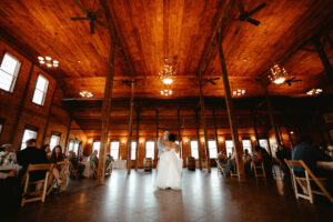 Bride and Groom dancing in Linganore Winecellars' environmentally friendly Abisso hall for a sustainable wedding 